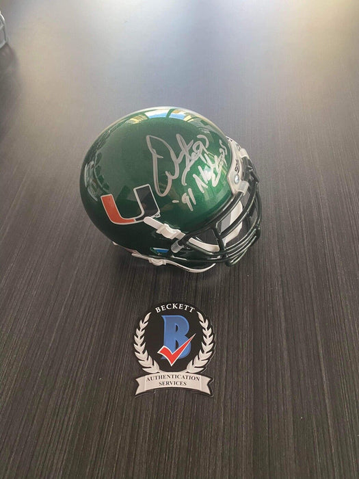 Warren Sapp Miami Hurricanes Autographed  Mini Helmet Beckett Inscribed